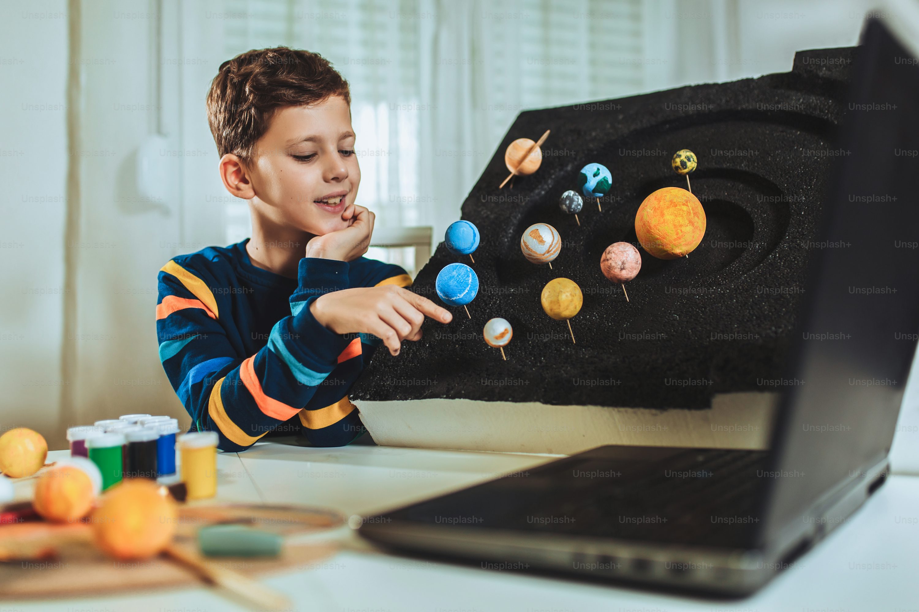 student looking at the solar system